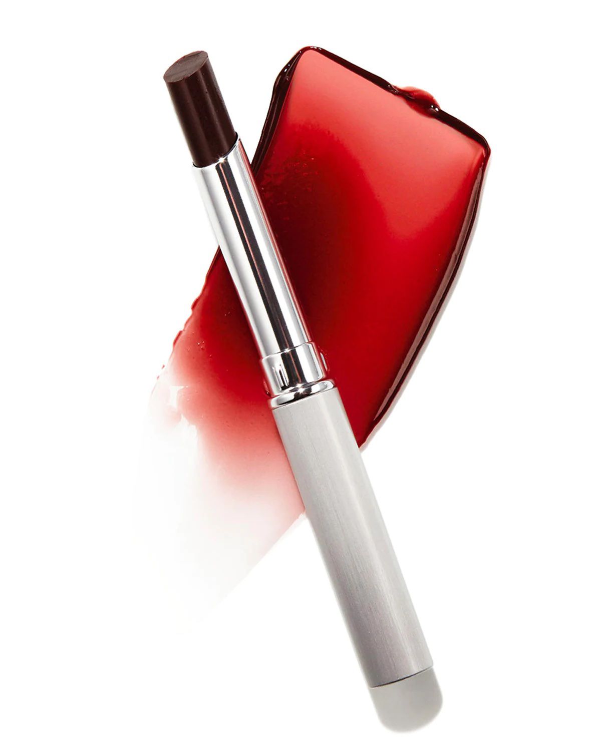 an image of a tube of Clinique Almost Lipstick in the Black Honey shade, superimposed atop a swatch of the lipstick