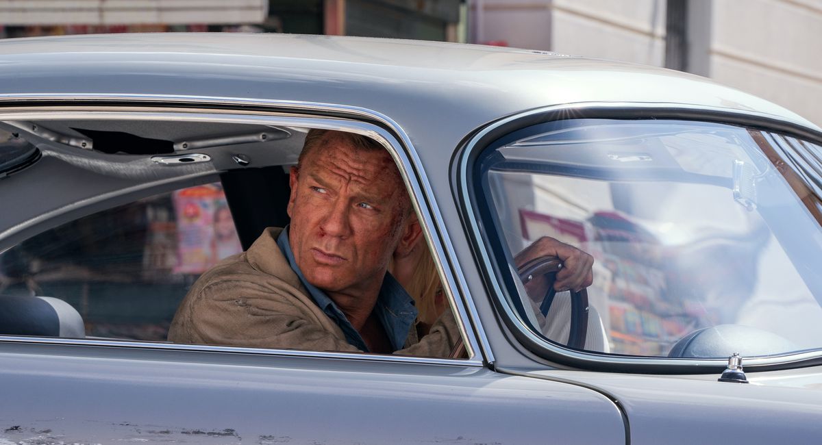 Daniel Craig looks beat to hell in a beat-to-hell care as James Bond in No Time To Die