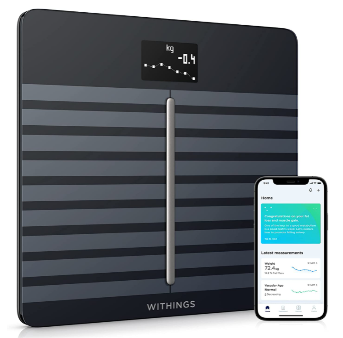 Best smart scale Withings product image of a black scale featuring grey stripes and an accompanying smartphone on the right side.