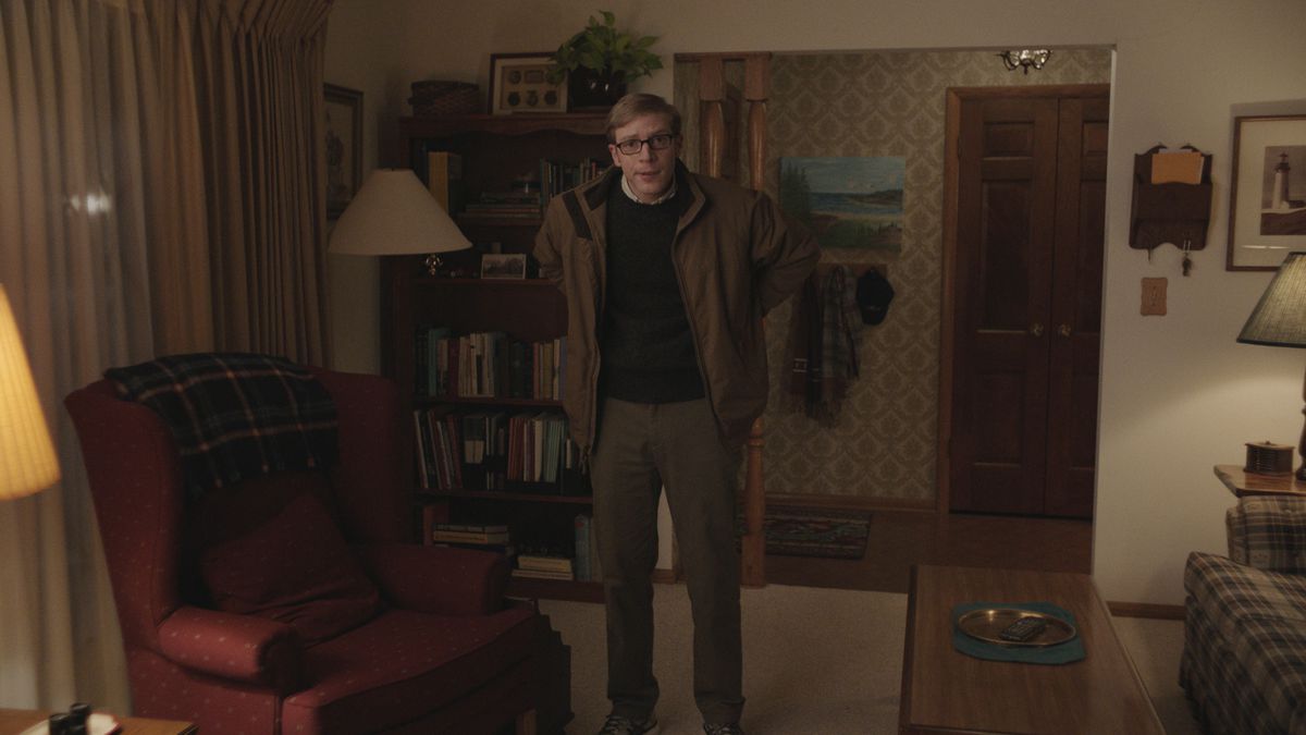 Joe Pera stands in his old-fashioned living room, in front of a red easy chair, in season 3 of Joe Pera Talks With You