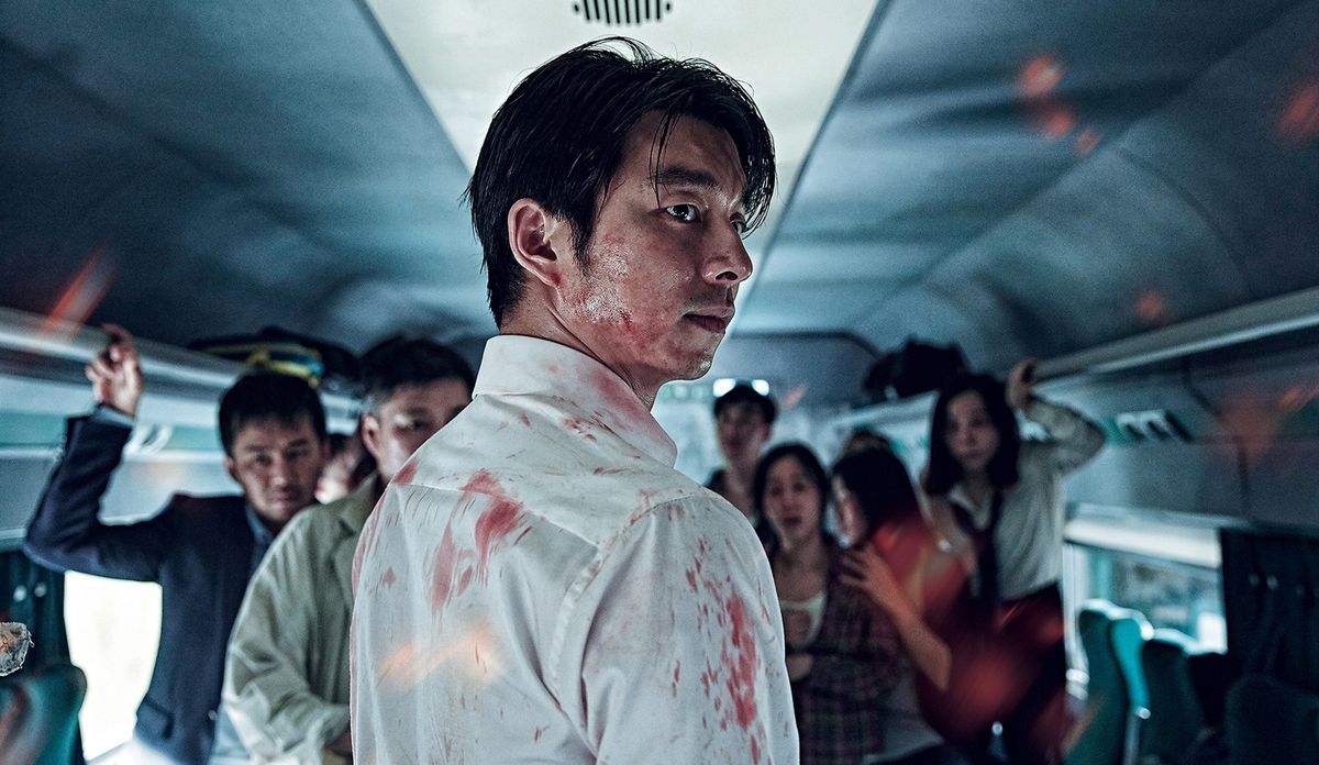 A bloodied Seok-woo (Yoo) looks over his shoulder.