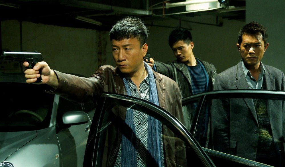 Sun Honglei as police captain Zhang Lei pointing a pistol in Drug War (2012)
