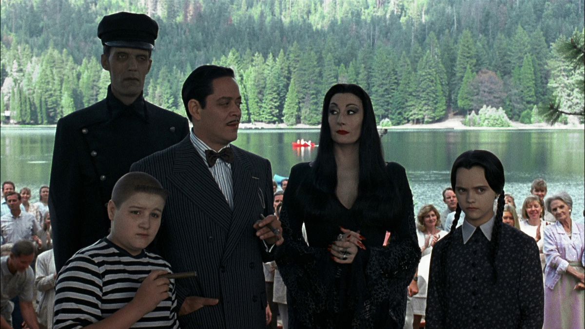 Lurch, Pugsley Addams, Gomez Addams, Morticia Addams, and Wednesday Addams at an outdoor summer camp in Addams Family Values (1993)