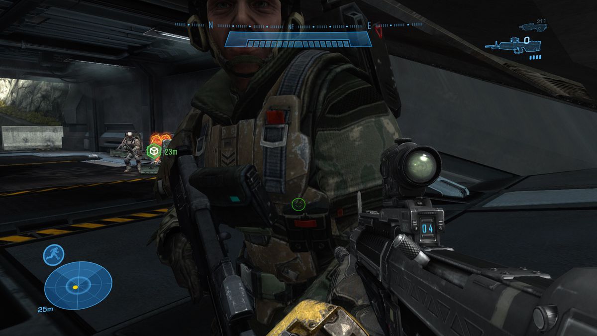 A soldier stands close to the player, showing off their gear