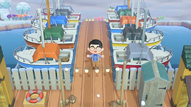 A player in Animal Crossing: New Horizons standing in the middle of a marina, made with yacht items, and a design illusion that makes it appear as if they are actually floating in the water.