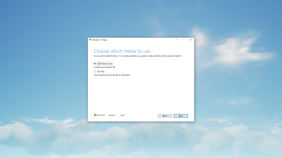 Windows 11 Media Creation Tool on a cloud background