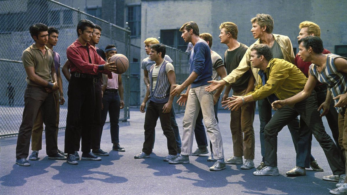 The Sharks and the Jets face off on a basketball court in West Side Story.