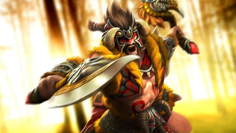 The Dota 2 hero, Beastmaster, lunges forward with his axe drawn and ready to strike