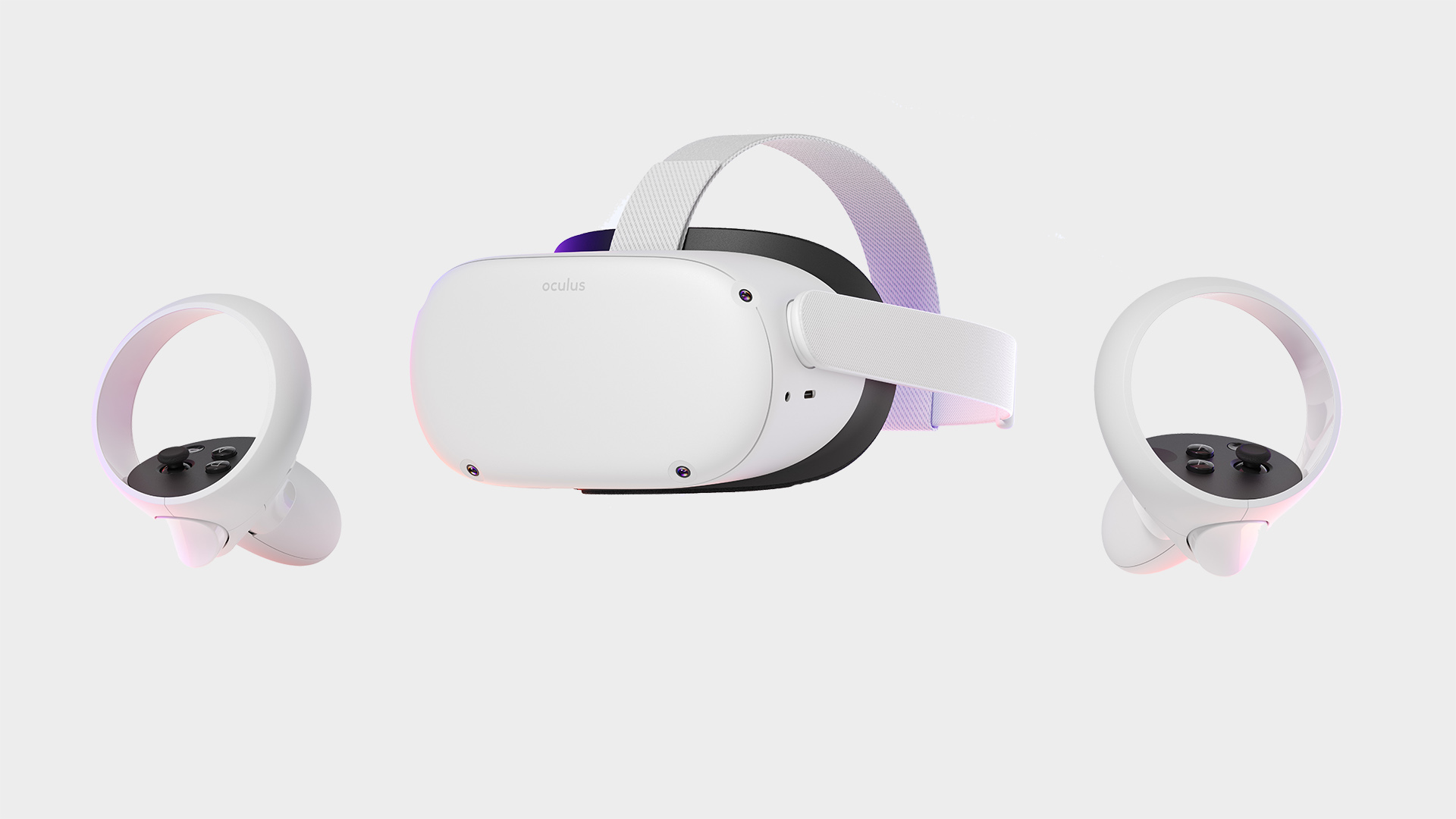 An Oculus Quest 2 pictured on a grey background with two controllers