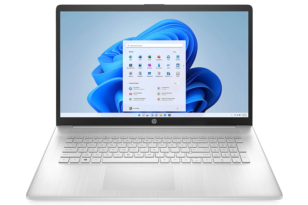 A silver HP laptop facing front with a Windows 11 desktop on the screen.