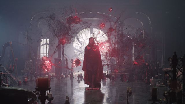 Benedict Cumberbatch as Doctor Strange standing in the middle of a blood-red glowing web of magical nodes in Doctor Strange in the Multiverse of Madness.
