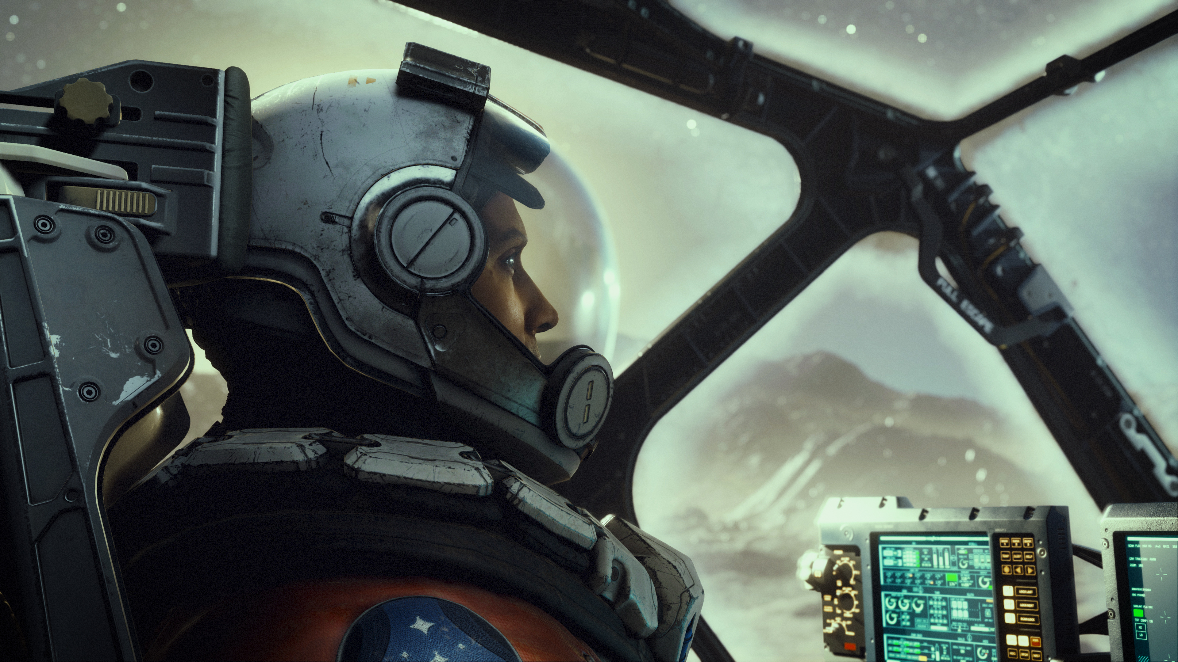 Starfield - A pilot sits in a cockpit wearing a space helmet and orange jumpsuit in front of monitors.