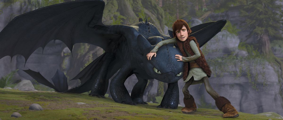 hiccup nervously stands next to toothless, who looks kinda pissed off, in How to Train Your Dragon