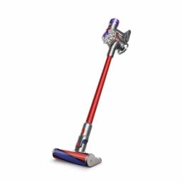 Red and purple Dyson vacuum on white background