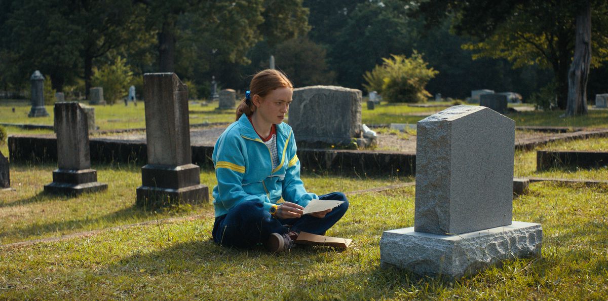 Max sitting in front of Billy’s grave
