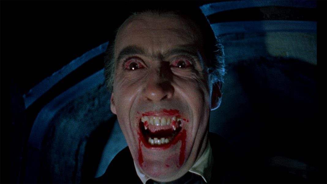 Christopher Lee with bloodshot eyes and bloodied fangs in 1958’s Dracula.