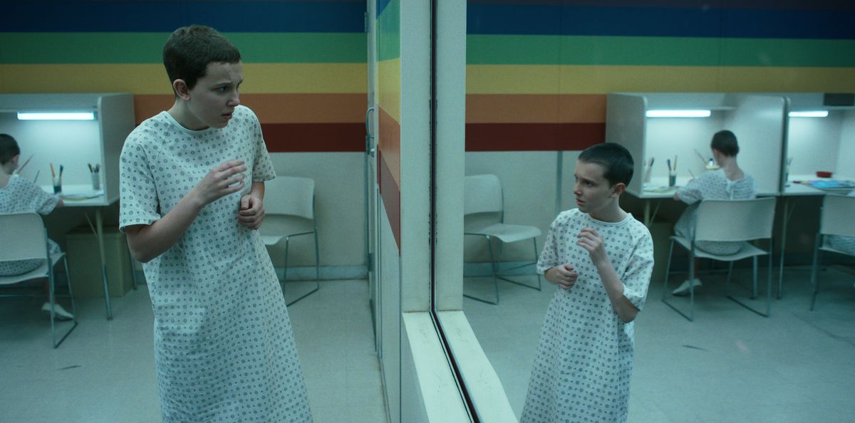 Eleven recoiling from her reflection of her younger self in the Rainbow Room