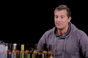 Bear Grylls takes the 'Hot Ones' challenge, only just holds it together