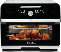 Air fryer toaster oven with a whole chicken inside