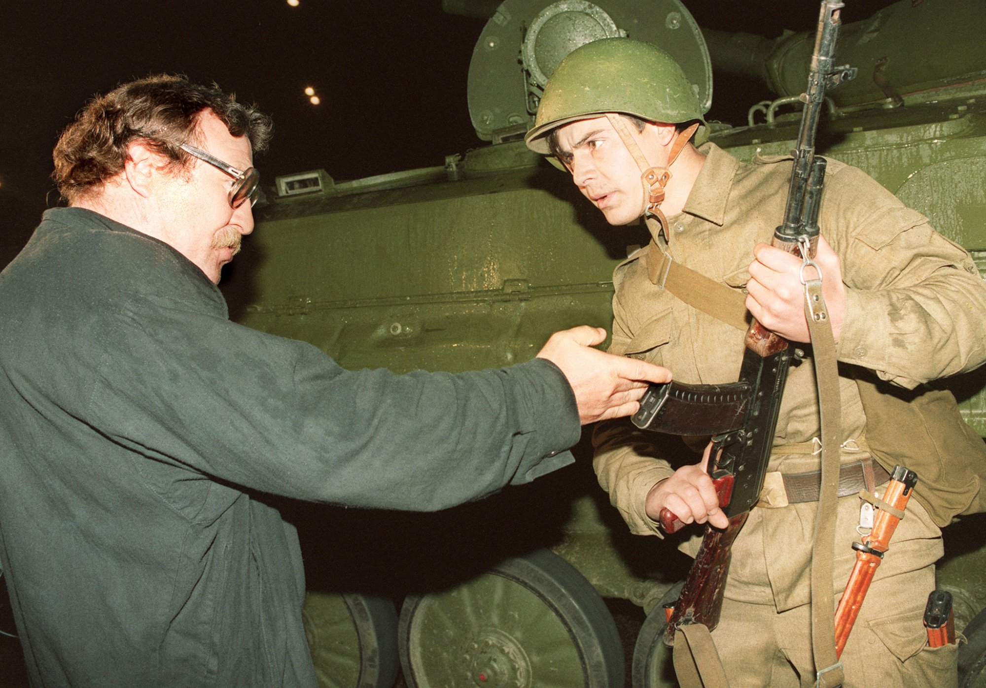 A pro-democracy demonstrator argues with a Soviet soldier late Aug. 20, 1991 as a tank block access to the center of Moscow.
