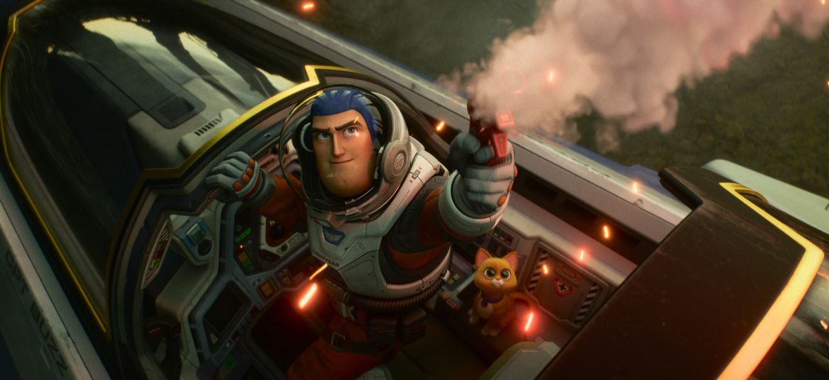 Buzz Lightyear and his robot cat Sox stand in the cockpit of an X-wing-like ship in Lightyear