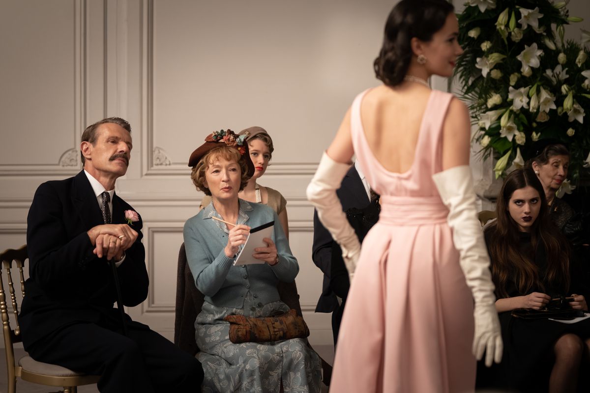 Lambert Wilson stars as Marquis de Chassange and Lesley Manville as Mrs. Harris, as they both admire a dress in Mrs. Harris Goes to Paris