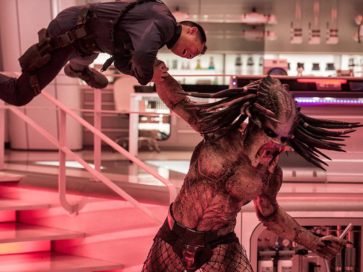 A unarmored Predator hoisting a terrified security guard in the air in The Predator.
