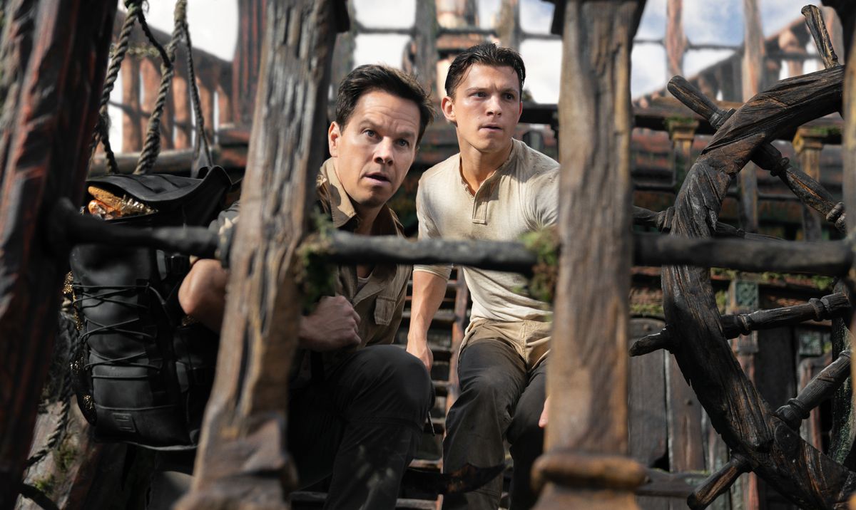 Victor “Sully” Sullivan (Mark Wahlberg) and Nathan Drake (Tom Holland) on a pirate ship in Uncharted