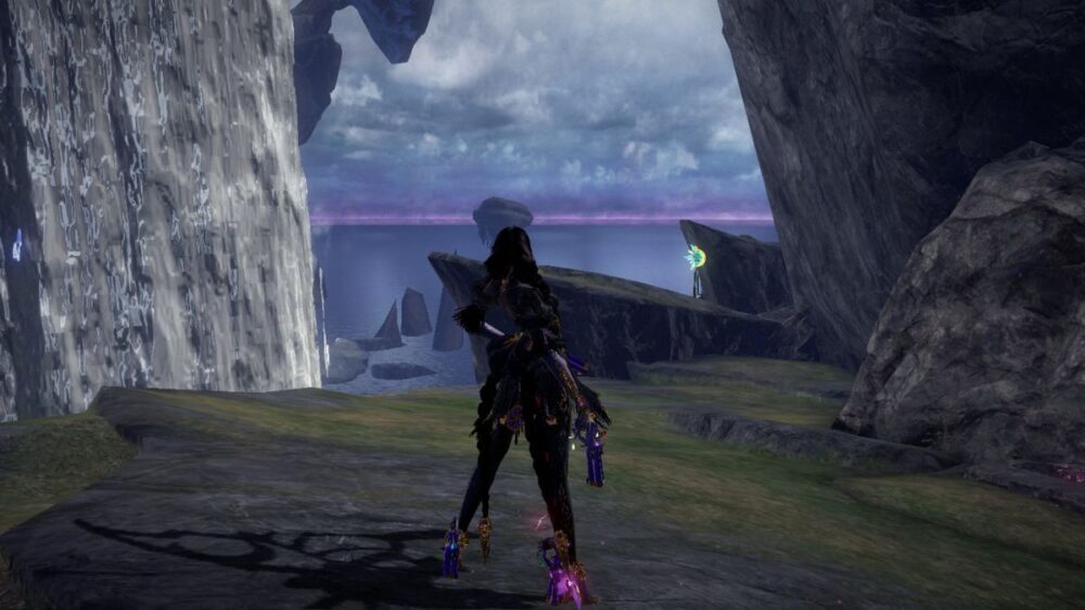 Bayonetta stands on a cliff and gazes at the horizon in Bayonetta 3.