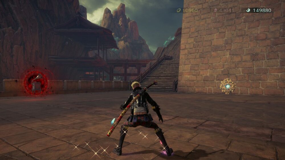 Viola stands at the bottom of some stairs that lead to castle ramparts in Bayonetta 3.