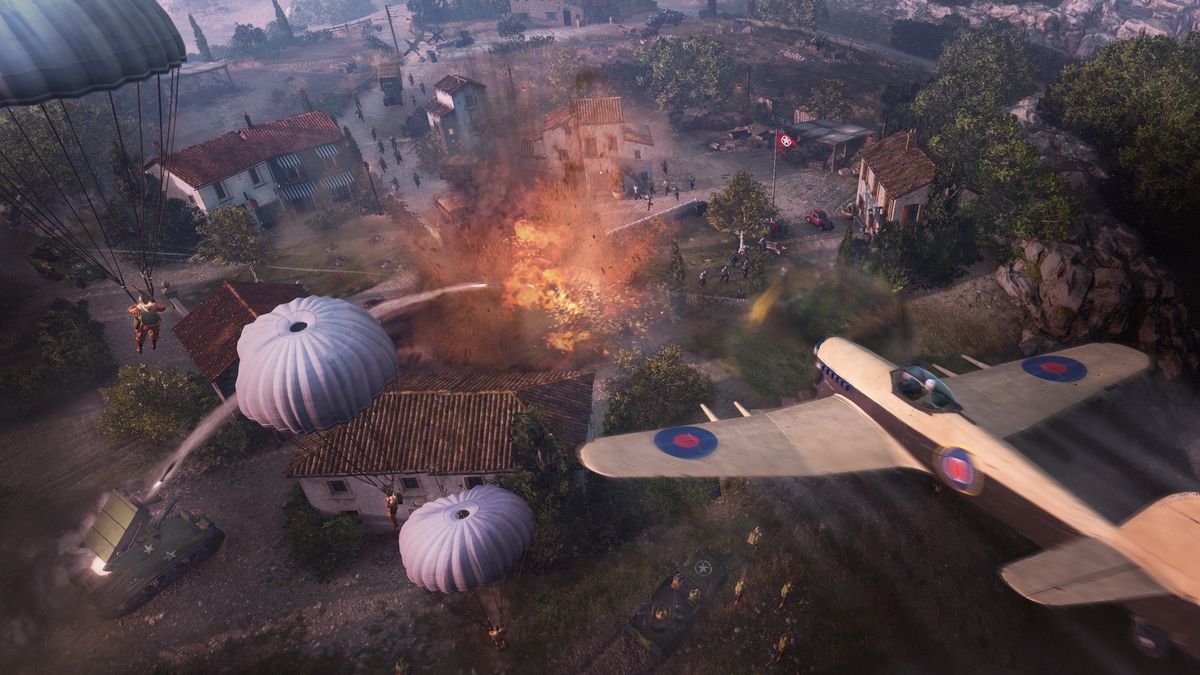 An Allied plane flies low alongside paratroopers above the Italian countryside in Company of Heroes 3