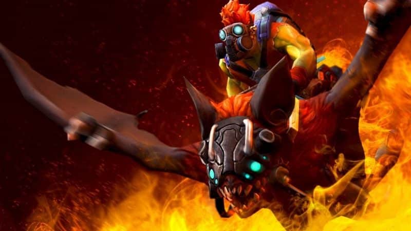 Dota 2 hero Batrider, a muscular, yellow humanoid creature with a gas mask on, riding a massive bat. Flames erupt behind them as they fly away.
