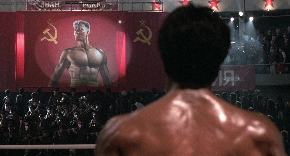Rocky stares at a giant russian banner of Drago