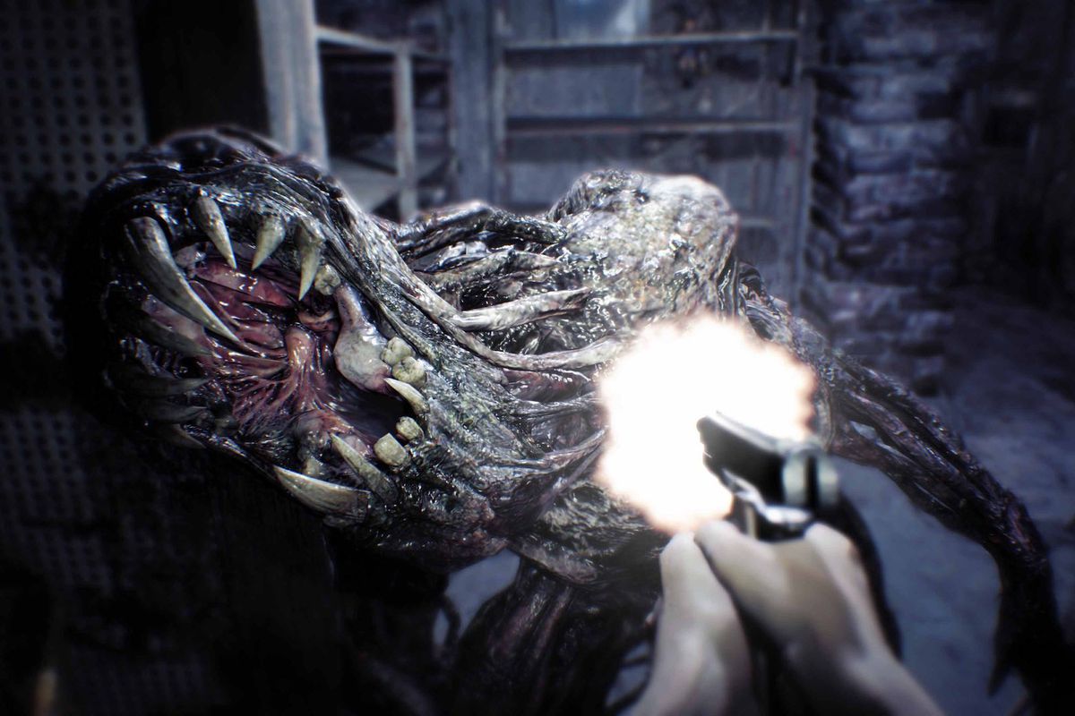 Ethan Winters fires his handgun at a Molded enemy as it attempts to eat him in Resident Evil 7: Biohazard