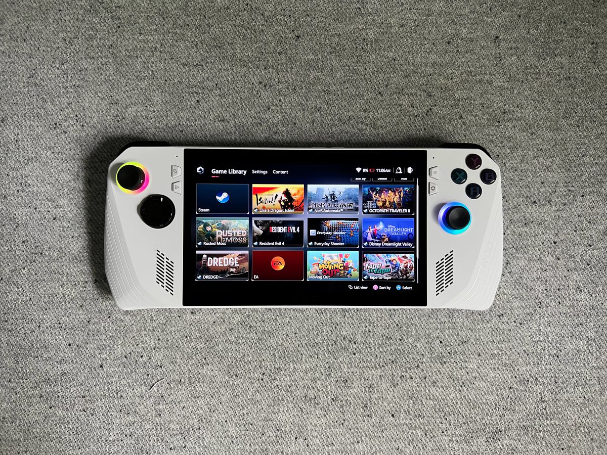 the game library screen of the Asus ROG Ally gaming handheld, lying on gray fabric, photographed from above