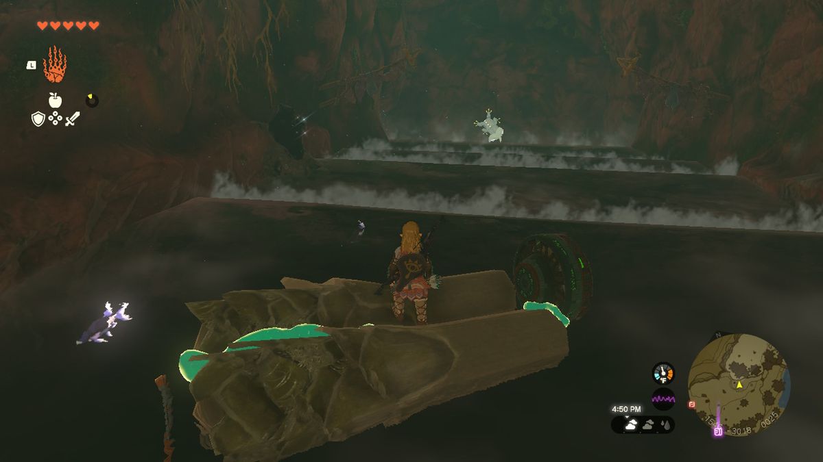 Link stares at a bubbulfrog in a cave with the rubber armor in Zelda Tears of the Kingdom.