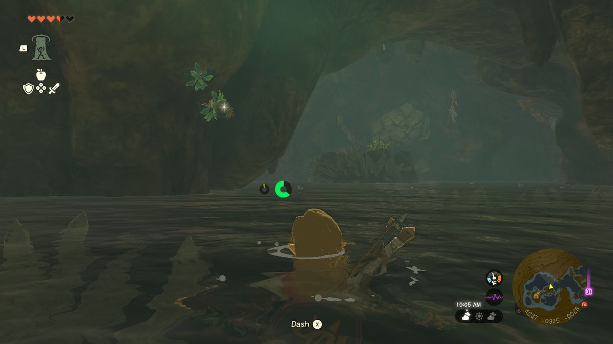 Link swims toward a large rock in a river in Zelda Tears of the Kingdom.
