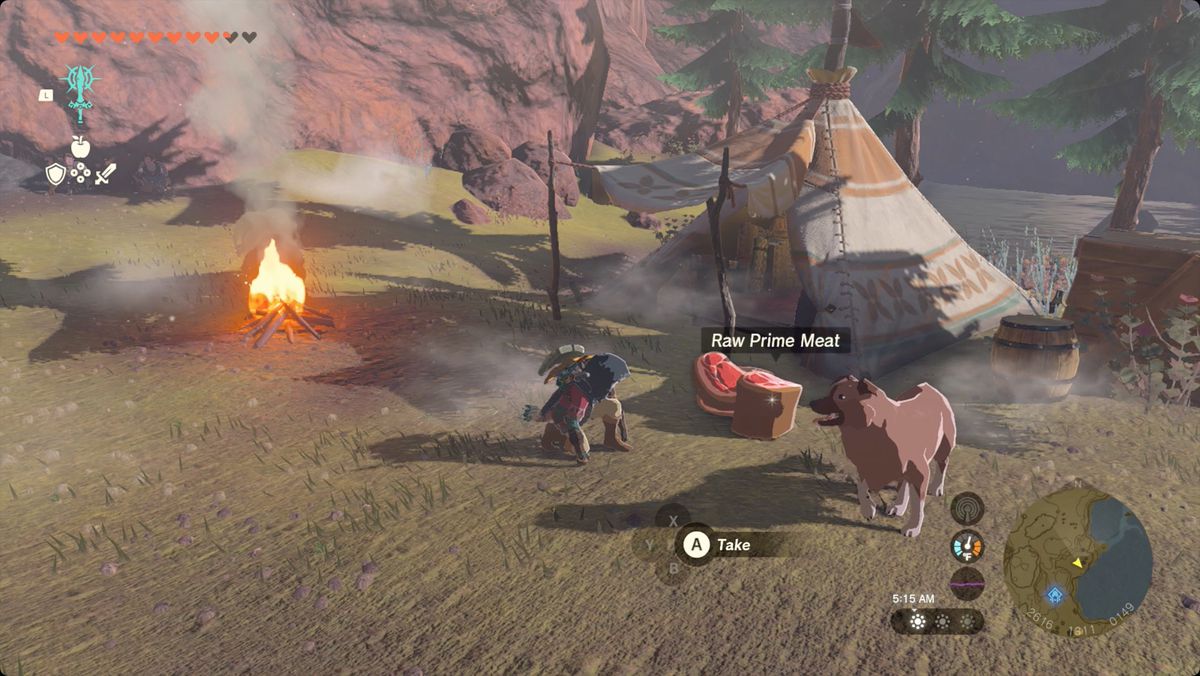 The Legend of Zelda: Tears of the Kingdom Link feeding a dog at a campsite near Cephla Lake Cave