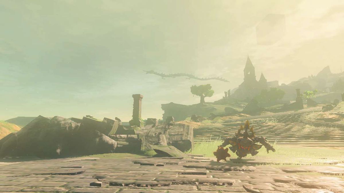 The ruins of the Temple of Time can be seen in the distance on the Great Plateau in Tears of the Kingdom. In the foreground there’s a pile of rubble and a menacing enemy