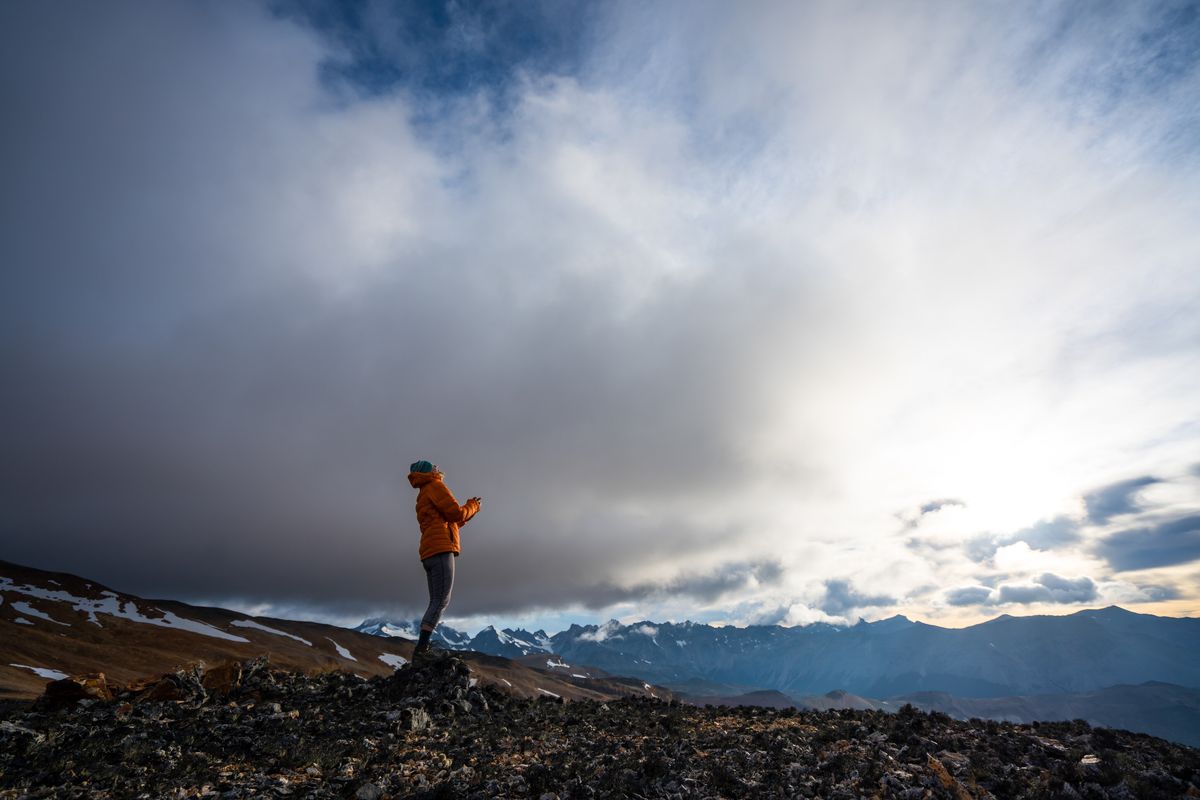 Kris Tompkins looks up at the sky with the Patagonian mountain range as her backdrop in Wild Life.