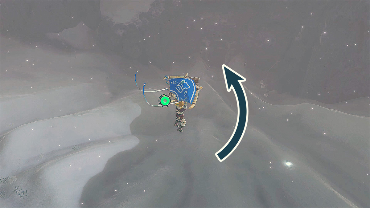 The Legend of Zelda: Tears of the Kingdom Link paragliding into the Kopeeki Drifts with an arrow pointing to the Kopeeki Drifts Cave entrance.