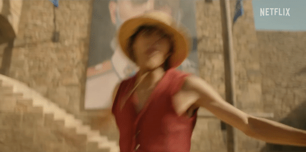 A gif of Luffy jumping and roundhouse kicking, with his leg stretching a few dozen feet as he kicks