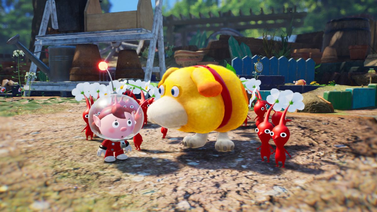 Pikmin 4’s spaceman stands next to Oatchi the dog and a group of red Pikmin