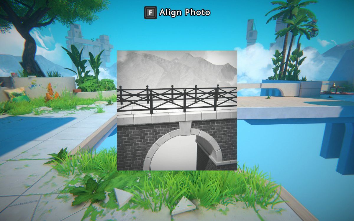 The player holds a black-and-white photo of a bridge up, covering an actual gap in the environment in Viewfinder