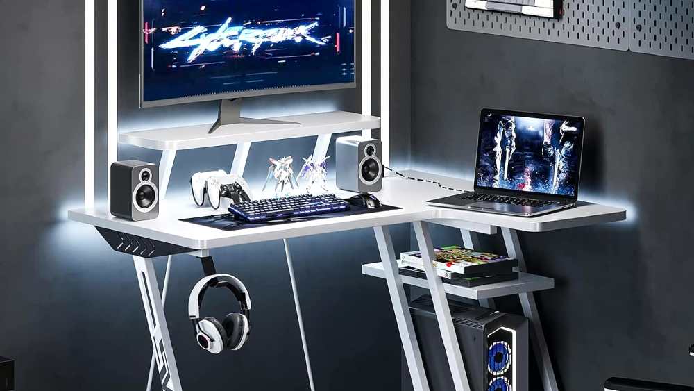 White gaming desk with cyber punk in monitor and a laptop