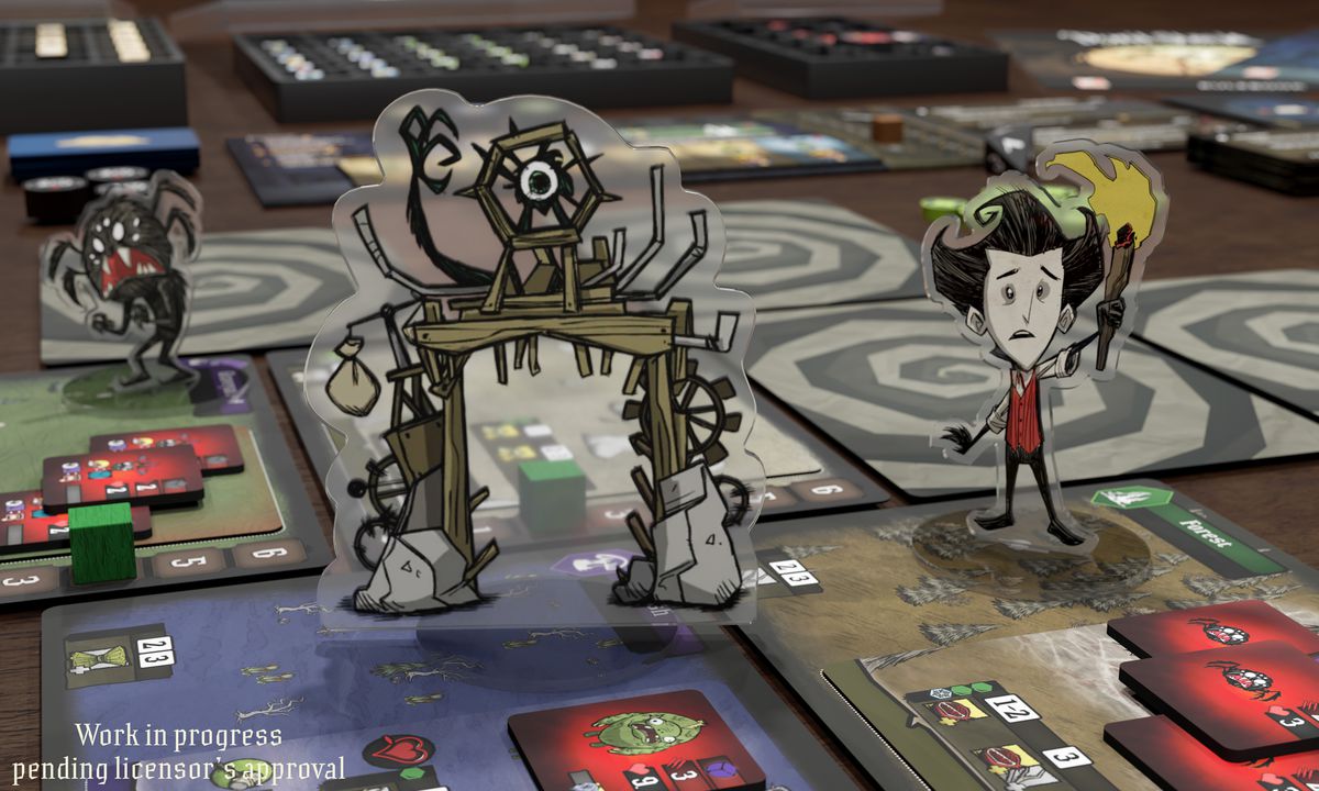 A photo of an early-game version of the don’t starve board game. It shows a character standing on square tiles. 