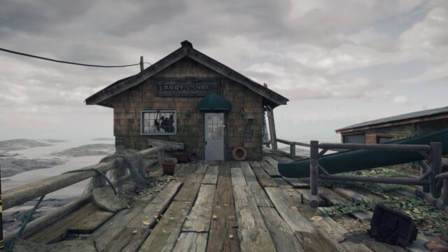 A screenshot from the game Open Roads showing a shack against a drab background of clouds and a drying beach behind it. A sign on the top indicates that it was once, "Larry's Shack"