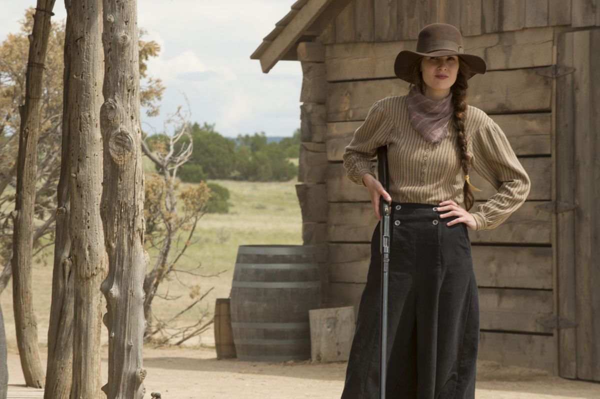 Michelle Dockery holds a rifle by her side in the frontier in Godless