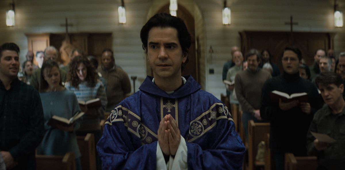 Hamish Linklater as Father Paul in Midnight Mass in the middle of mass